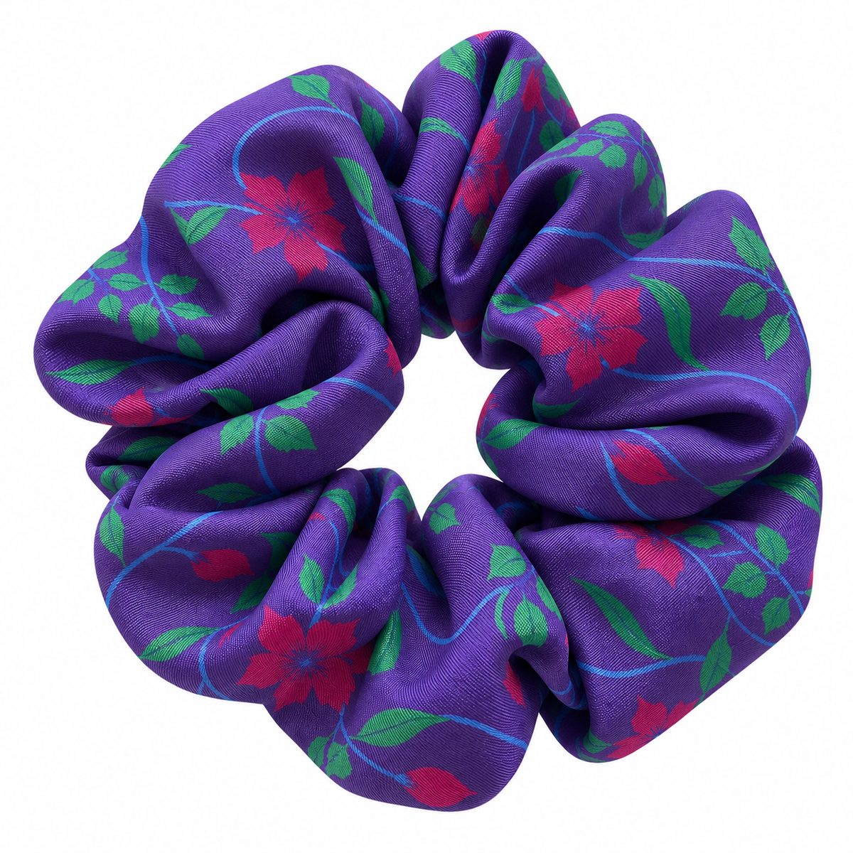 Close up of a purple silk hair scrunchie with limited edition purple hibiscus halloween print