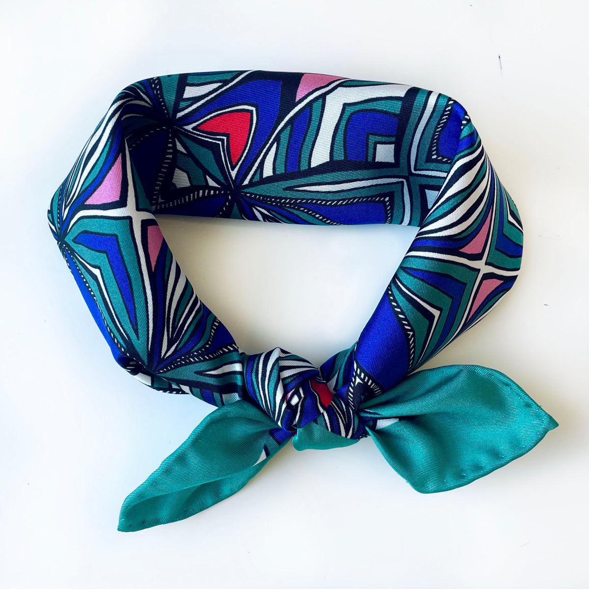 Hearts and Stripes printed silk square folded and tied in a knot, with teal ends and red heart details